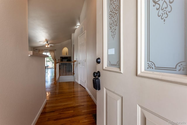 corridor with hardwood / wood-style floors