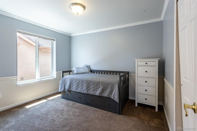 carpeted bedroom featuring crown molding