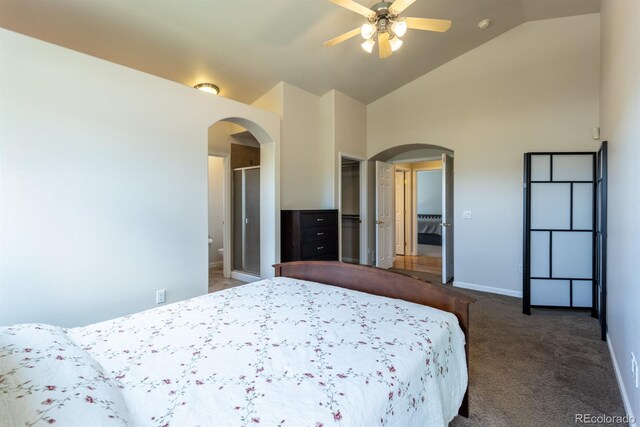 carpeted bedroom with ceiling fan and high vaulted ceiling