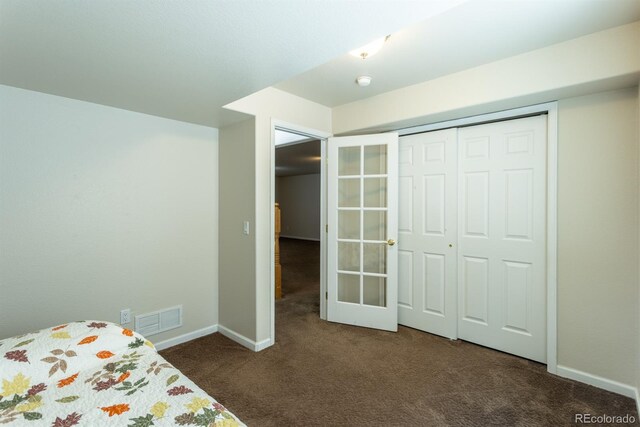 unfurnished bedroom featuring a closet and carpet