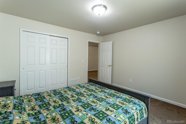 unfurnished bedroom with carpet and a closet