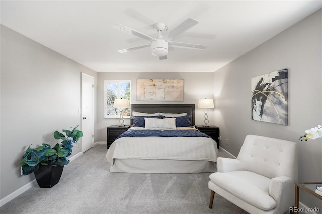 bedroom with baseboards, carpet flooring, and a ceiling fan