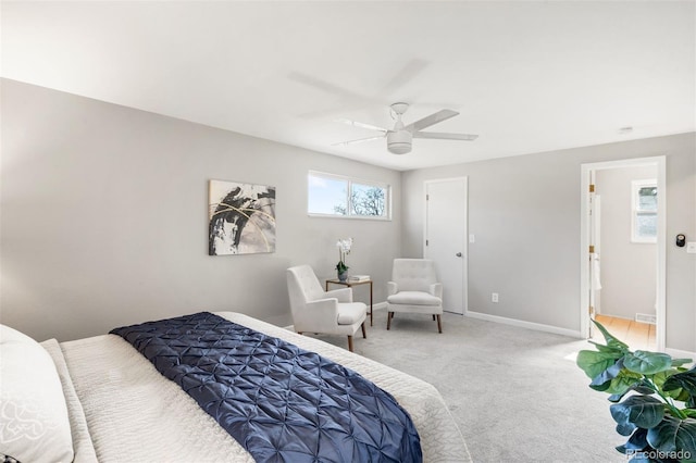 carpeted bedroom featuring baseboards and ceiling fan