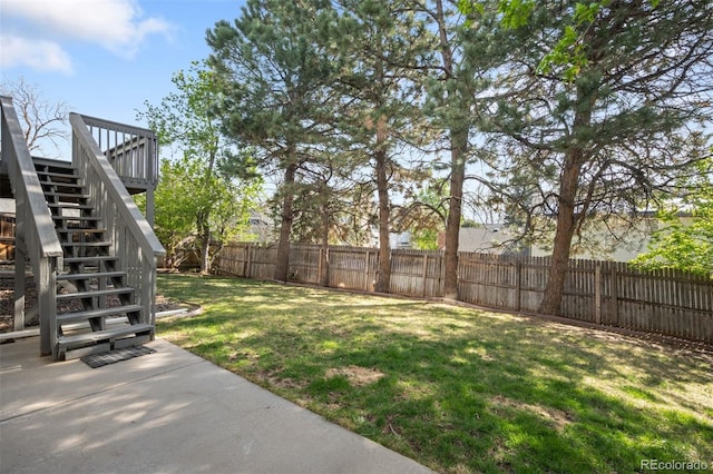 view of yard featuring stairs and a patio