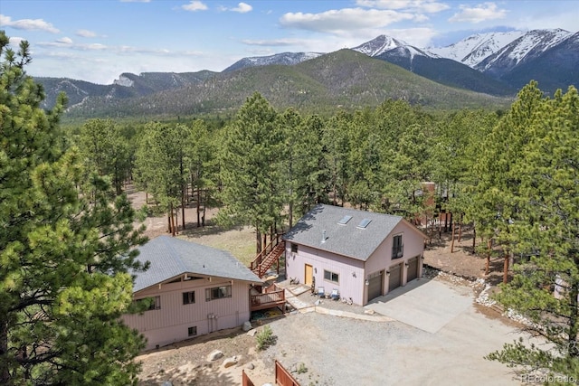 birds eye view of property featuring a mountain view