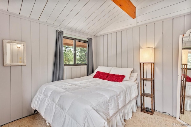 bedroom with vaulted ceiling with beams
