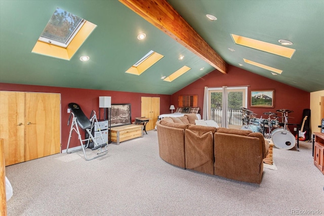 carpeted living area with lofted ceiling with skylight and recessed lighting