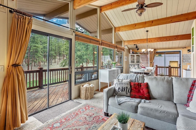 sunroom / solarium featuring a chandelier and beam ceiling
