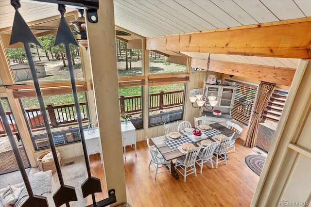 interior space featuring wooden ceiling, a healthy amount of sunlight, and wood finished floors