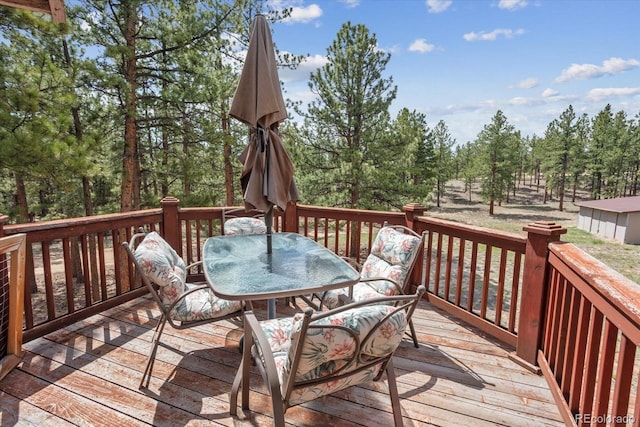 wooden deck with outdoor dining area