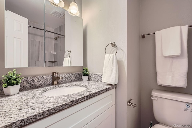 5925 W 86th Ave, Arvada, CO 80003 - bathroom featuring vanity and a tile shower