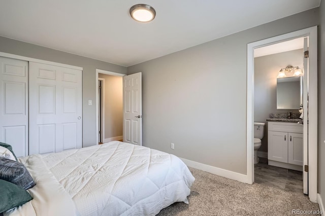 5925 W 86th Ave, Arvada, CO 80003 - bedroom with light colored carpet, connected bathroom, and a closet