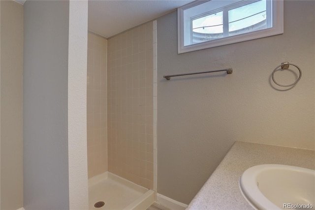 5925 W 86th Ave, Arvada, CO 80003 - full bathroom featuring tiled shower and vanity