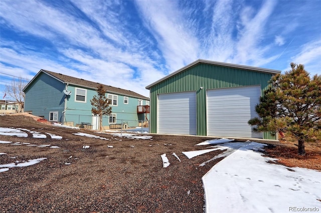 exterior space featuring an outbuilding and a garage