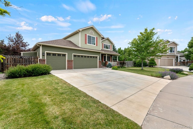 5980 Dunraven Ct, Golden, CO 80403 - view of front facade featuring driveway, an attached garage, and brick siding