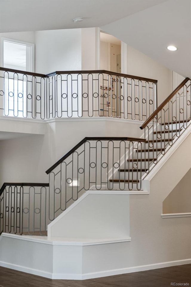 5980 Dunraven Ct, Golden, CO 80403 - stairs featuring wood finished floors and recessed lighting