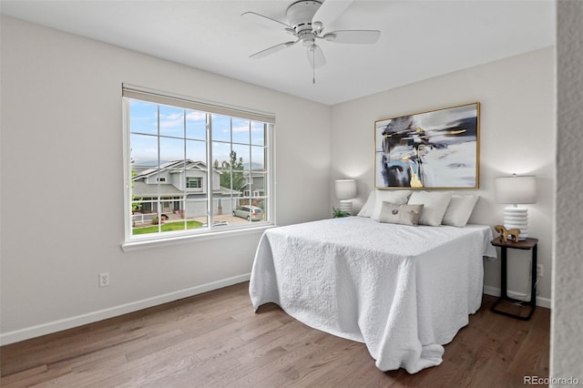 5980 Dunraven Ct, Golden, CO 80403 - bedroom with wood finished floors and a ceiling fan