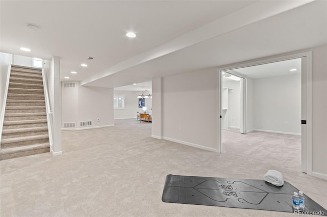 5980 Dunraven Ct, Golden, CO 80403 - finished below grade area featuring light colored carpet, stairs, and recessed lighting