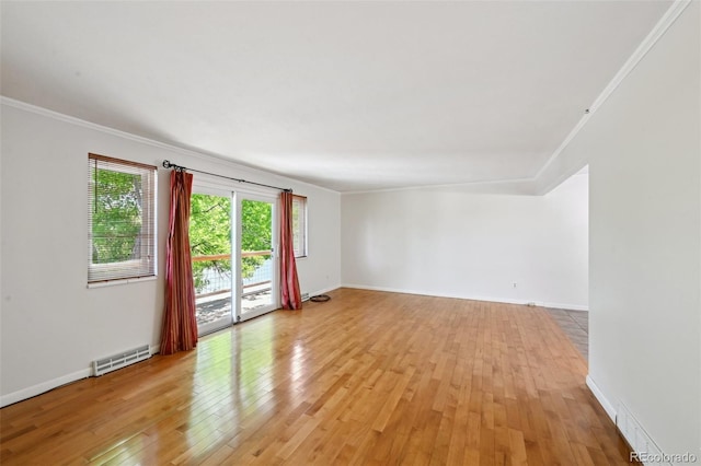 1073 Xenon St, Golden, CO 80401 - unfurnished room with crown molding, light wood-style floors, and baseboards