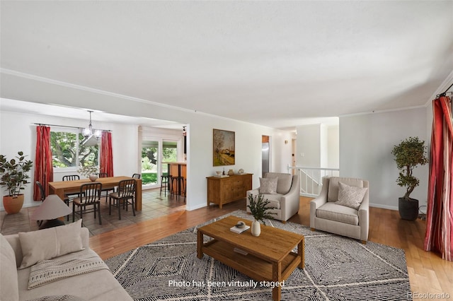 1073 Xenon St, Golden, CO 80401 - living area featuring light wood-type flooring, a chandelier, and baseboards