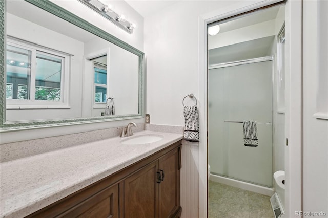 1073 Xenon St, Golden, CO 80401 - bathroom featuring toilet, a stall shower, and vanity