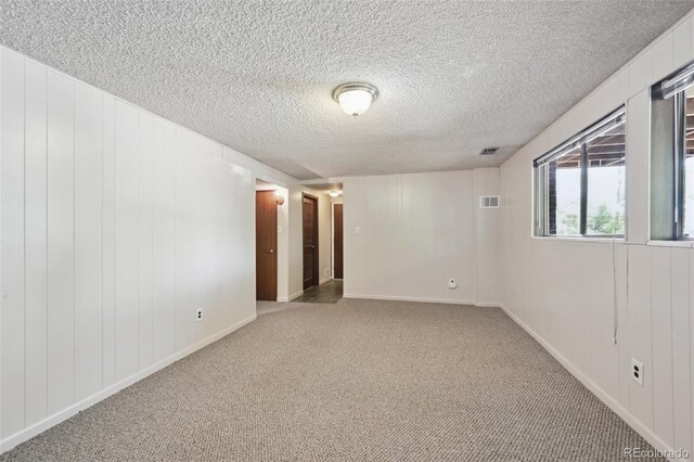 1073 Xenon St, Golden, CO 80401 - unfurnished room featuring carpet flooring, a textured ceiling, and baseboards
