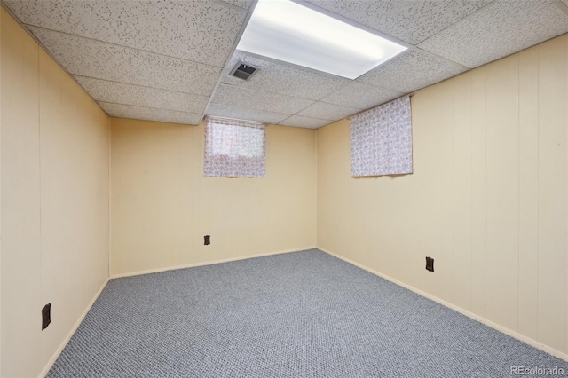 1073 Xenon St, Golden, CO 80401 - below grade area featuring carpet, a paneled ceiling, and baseboards
