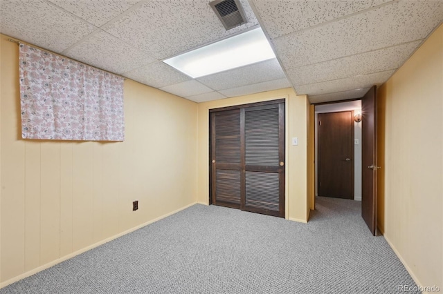 1073 Xenon St, Golden, CO 80401 - unfurnished bedroom featuring carpet floors, a drop ceiling, a closet, and baseboards