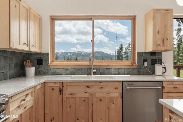 452 Gcr 835, Fraser, CO 80442 - kitchen featuring dishwasher, light brown cabinetry, light countertops, and decorative backsplash