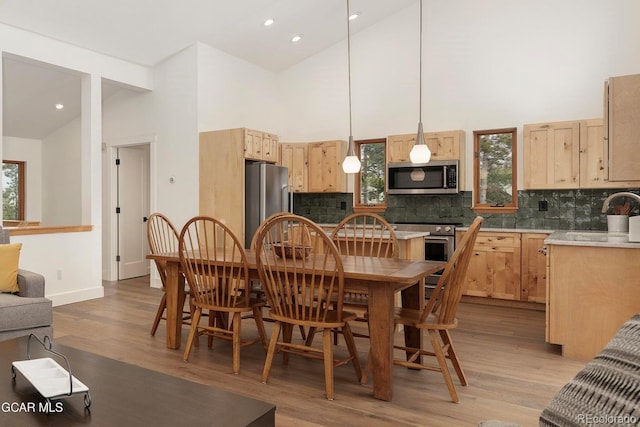 452 Gcr 835, Fraser, CO 80442 - dining room featuring light wood-style floors, high vaulted ceiling, and recessed lighting