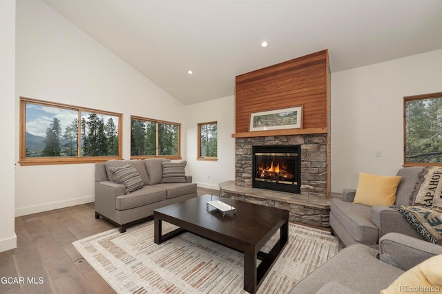 452 Gcr 835, Fraser, CO 80442 - living area featuring a fireplace, hardwood / wood-style floors, recessed lighting, and high vaulted ceiling