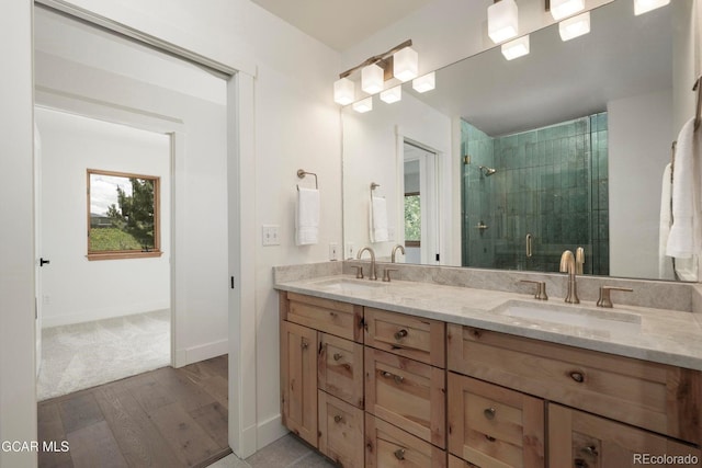 452 Gcr 835, Fraser, CO 80442 - full bathroom featuring double vanity, a shower stall, and wood finished floors