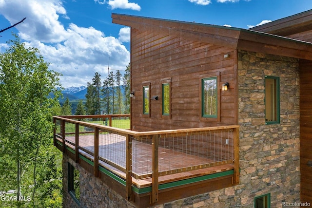 452 Gcr 835, Fraser, CO 80442 - view of home's exterior with stone siding and a deck with mountain view