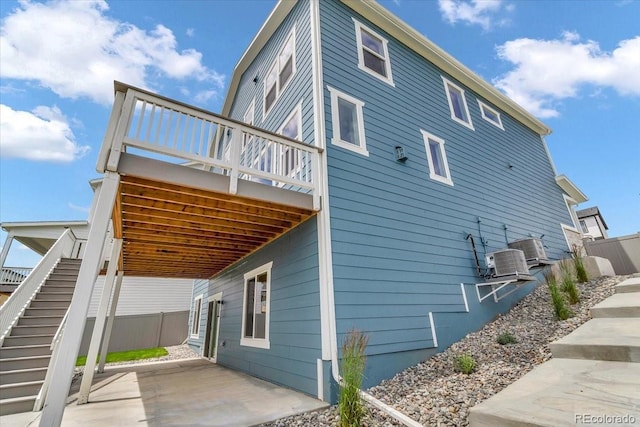 900 Eldorado Ln, Louisville, CO 80027 - view of side of property featuring a patio, stairway, and a deck