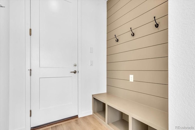 900 Eldorado Ln, Louisville, CO 80027 - mudroom with light wood-type flooring and wooden walls