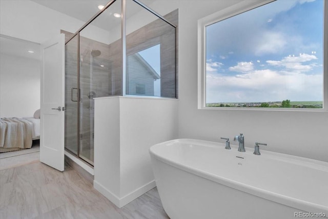 900 Eldorado Ln, Louisville, CO 80027 - ensuite bathroom with a freestanding bath, healthy amount of natural light, a stall shower, recessed lighting, and marble finish floors