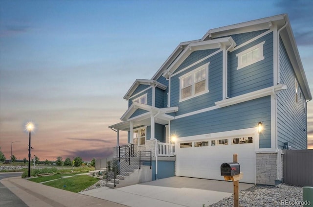 900 Eldorado Ln, Louisville, CO 80027 - craftsman-style house featuring a garage, stone siding, and driveway