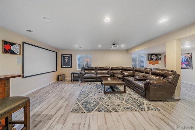 cinema room featuring baseboards, wood finished floors, visible vents, and recessed lighting