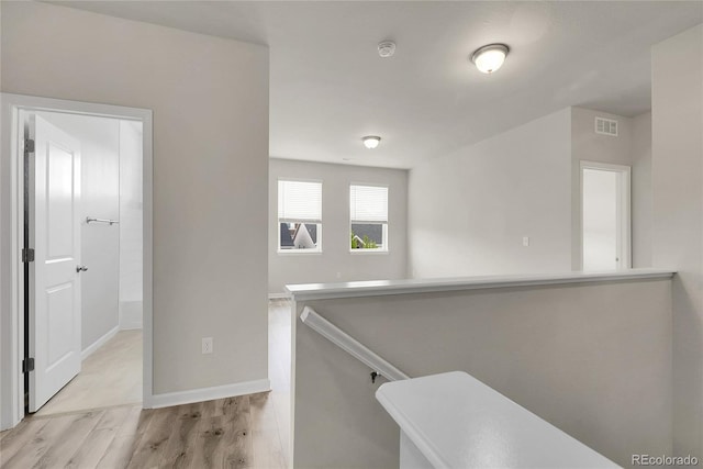 23895 E Rocky Top Pl, Aurora, CO 80016 - hall with an upstairs landing, wood finished floors, and baseboards