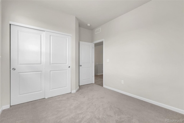 23895 E Rocky Top Pl, Aurora, CO 80016 - unfurnished bedroom with carpet floors, baseboards, and a closet