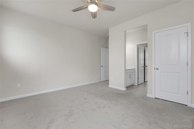 23895 E Rocky Top Pl, Aurora, CO 80016 - unfurnished bedroom with light colored carpet, baseboards, and ceiling fan