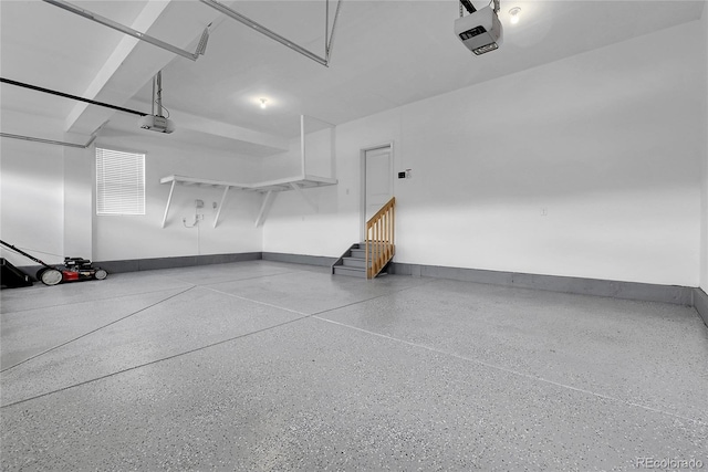 23895 E Rocky Top Pl, Aurora, CO 80016 - garage with a garage door opener and baseboards