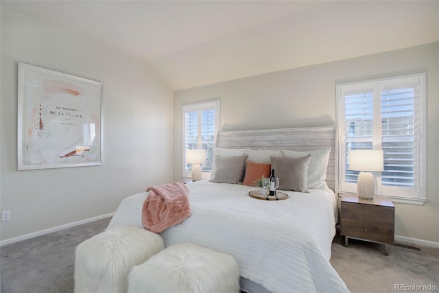 bedroom featuring vaulted ceiling and carpet