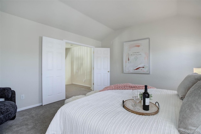 carpeted bedroom featuring lofted ceiling