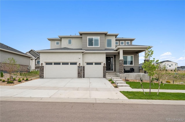 23814 E 36th Pl, Aurora, CO 80019 - prairie-style home with stucco siding, stone siding, driveway, a garage, and covered porch