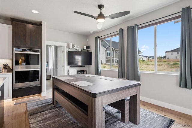 23814 E 36th Pl, Aurora, CO 80019 - office area with healthy amount of natural light, a ceiling fan, wood finished floors, and recessed lighting