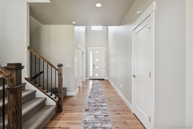 23814 E 36th Pl, Aurora, CO 80019 - foyer entrance featuring light wood finished floors and stairs