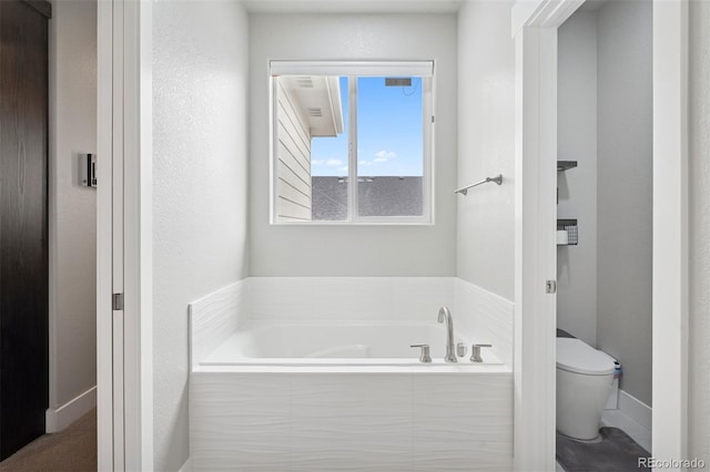 23814 E 36th Pl, Aurora, CO 80019 - bathroom featuring toilet and a bath
