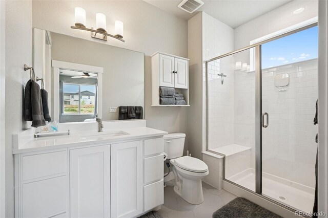 23814 E 36th Pl, Aurora, CO 80019 - bathroom with a shower stall, vanity, tile patterned flooring, and a ceiling fan