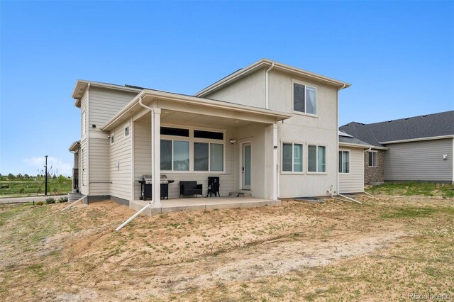 23814 E 36th Pl, Aurora, CO 80019 - back of house featuring a patio area